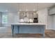 Modern kitchen island with white quartz countertop and gray cabinets at 203 Arabella Pkwy, Locust Grove, GA 30248