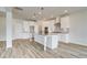 White kitchen with stainless appliances, gray countertops, and gray backsplash at 203 Arabella Pkwy, Locust Grove, GA 30248