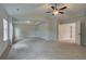 Large main bedroom with ceiling fan and multiple windows, carpet flooring at 203 Arabella Pkwy, Locust Grove, GA 30248