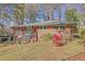 Brick ranch house with a landscaped yard and attached deck at 2289 Montrose Dr, East Point, GA 30344