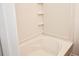 Bathroom with tub and tiled surround at 2374 Suwanee Pointe Dr, Lawrenceville, GA 30043