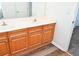 Double sink bathroom vanity with wood cabinets at 2374 Suwanee Pointe Dr, Lawrenceville, GA 30043