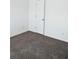 Small carpeted bedroom with a closet at 2374 Suwanee Pointe Dr, Lawrenceville, GA 30043