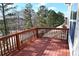 Spacious deck with wooden railing, offering scenic views at 2374 Suwanee Pointe Dr, Lawrenceville, GA 30043