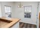 Bright dining area with wood floors and window at 2374 Suwanee Pointe Dr, Lawrenceville, GA 30043