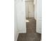 Hallway with carpet and doors to rooms at 2374 Suwanee Pointe Dr, Lawrenceville, GA 30043