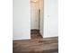 A hallway with light walls and hardwood floors at 2374 Suwanee Pointe Dr, Lawrenceville, GA 30043