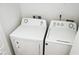 Laundry room with side-by-side washer and dryer at 2374 Suwanee Pointe Dr, Lawrenceville, GA 30043