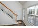 Open staircase leading to upper level, near sliding glass door at 2374 Suwanee Pointe Dr, Lawrenceville, GA 30043