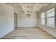 Bright dining room with hardwood floors and tray ceiling at 443 Lothbury Ave, Locust Grove, GA 30248