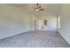 Main bedroom with carpet, ceiling fan and en suite bathroom at 443 Lothbury Ave, Locust Grove, GA 30248