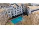 Stunning aerial view of the building and pool with lounge area and tables at 821 Ralph Mcgill Ne Blvd # 3216, Atlanta, GA 30306
