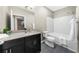 Well-lit bathroom featuring a modern vanity, a large mirror, and a shower-tub combination at 821 Ralph Mcgill Ne Blvd # 3216, Atlanta, GA 30306