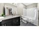 Modern bathroom with dark vanity, white subway tile, and bathtub at 821 Ralph Mcgill Ne Blvd # 3216, Atlanta, GA 30306