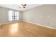 Bright bedroom featuring hardwood floors, a ceiling fan, and a window with white curtains at 821 Ralph Mcgill Ne Blvd # 3216, Atlanta, GA 30306