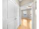 A view through an open doorway into a bedroom with hardwood floors and a ceiling fan at 821 Ralph Mcgill Ne Blvd # 3216, Atlanta, GA 30306