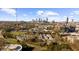 Skyline view featuring modern buildings and lush greenery, complemented by a clear blue sky with scattered clouds at 821 Ralph Mcgill Ne Blvd # 3216, Atlanta, GA 30306