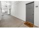 Bright hallway with modern gray door and concrete flooring at 821 Ralph Mcgill Ne Blvd # 3216, Atlanta, GA 30306