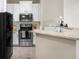 Modern kitchen with stainless steel appliances and granite counters at 821 Ralph Mcgill Ne Blvd # 3216, Atlanta, GA 30306