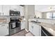 Contemporary kitchen with stainless appliances, white cabinets, and granite countertops at 821 Ralph Mcgill Ne Blvd # 3216, Atlanta, GA 30306