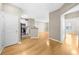 Open-concept living area with hardwood floors, neutral paint and seamless flow into the adjacent kitchen at 821 Ralph Mcgill Ne Blvd # 3216, Atlanta, GA 30306