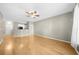 Open-concept living area with hardwood floors, a ceiling fan, and a view of the kitchen at 821 Ralph Mcgill Ne Blvd # 3216, Atlanta, GA 30306