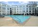 Apartment community outdoor pool area with a fountain and ample lounge chairs at 821 Ralph Mcgill Ne Blvd # 3216, Atlanta, GA 30306
