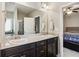 Bathroom with double vanity and view of bedroom at 100 Orchard Ln, Covington, GA 30014