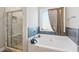 Relaxing bathroom with soaking tub and walk-in shower at 100 Orchard Ln, Covington, GA 30014