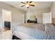 Bright bedroom with a king-size bed and access to bathroom at 100 Orchard Ln, Covington, GA 30014