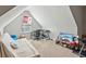Spacious bonus room with a sofa, desk, and TV at 100 Orchard Ln, Covington, GA 30014