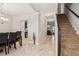 Bright and spacious foyer with tile floors and a staircase leading upstairs at 100 Orchard Ln, Covington, GA 30014