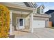 Inviting front entry with white door, brick columns, and lush yellow bushes at 100 Orchard Ln, Covington, GA 30014