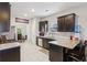 Modern kitchen with dark cabinetry, granite counters, and stainless steel appliances at 100 Orchard Ln, Covington, GA 30014