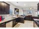 Spacious kitchen with dark cabinets, granite countertops and open-concept design at 100 Orchard Ln, Covington, GA 30014