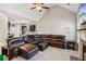 Open living room showcasing a sectional sofa and kitchen at 100 Orchard Ln, Covington, GA 30014