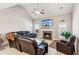 Spacious living room with a fireplace and large sectional sofa at 100 Orchard Ln, Covington, GA 30014