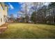 Expansive backyard with grassy area and mature trees at 286 Heathridge Se Ln, Mableton, GA 30126