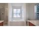 Main bathroom with soaking tub, shower, and window at 286 Heathridge Se Ln, Mableton, GA 30126
