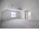 Large bonus room featuring a ceiling fan and access to upper floor at 286 Heathridge Se Ln, Mableton, GA 30126