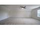Spacious bonus room with ceiling fan and window at 286 Heathridge Se Ln, Mableton, GA 30126