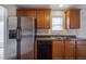 Kitchen with stainless steel appliances and wood cabinets at 286 Heathridge Se Ln, Mableton, GA 30126