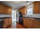 Kitchen with stainless steel appliances and wood cabinets at 286 Heathridge Se Ln, Mableton, GA 30126
