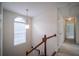 Upstairs hallway with window and access to bedrooms at 286 Heathridge Se Ln, Mableton, GA 30126