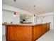 Basement bar with wood cabinetry and granite countertop at 3955 Three Chimneys Ln, Cumming, GA 30041
