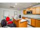 Basement kitchenette with wood cabinets and island at 3955 Three Chimneys Ln, Cumming, GA 30041