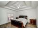 Spacious bedroom with wood flooring and access to a deck at 3955 Three Chimneys Ln, Cumming, GA 30041
