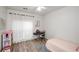 Bright bedroom with wood flooring and window at 3955 Three Chimneys Ln, Cumming, GA 30041