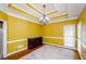 Formal dining room with hardwood floors and yellow walls at 3955 Three Chimneys Ln, Cumming, GA 30041