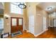 Bright two-story foyer with hardwood floors and double doors at 3955 Three Chimneys Ln, Cumming, GA 30041